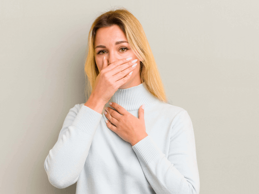 Woman in pain experiencing bleeding from mouth